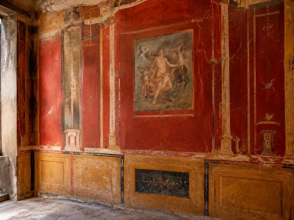 A red and ochre fresco inside a Herculaneum house